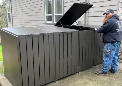 Custom iron fenced garbage enclosure